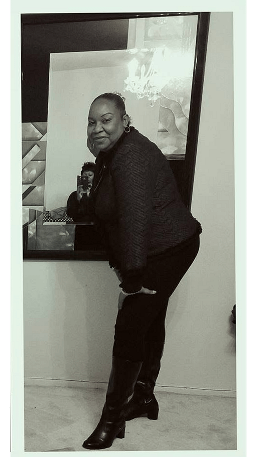 Cici Vibes leaning in black outfit