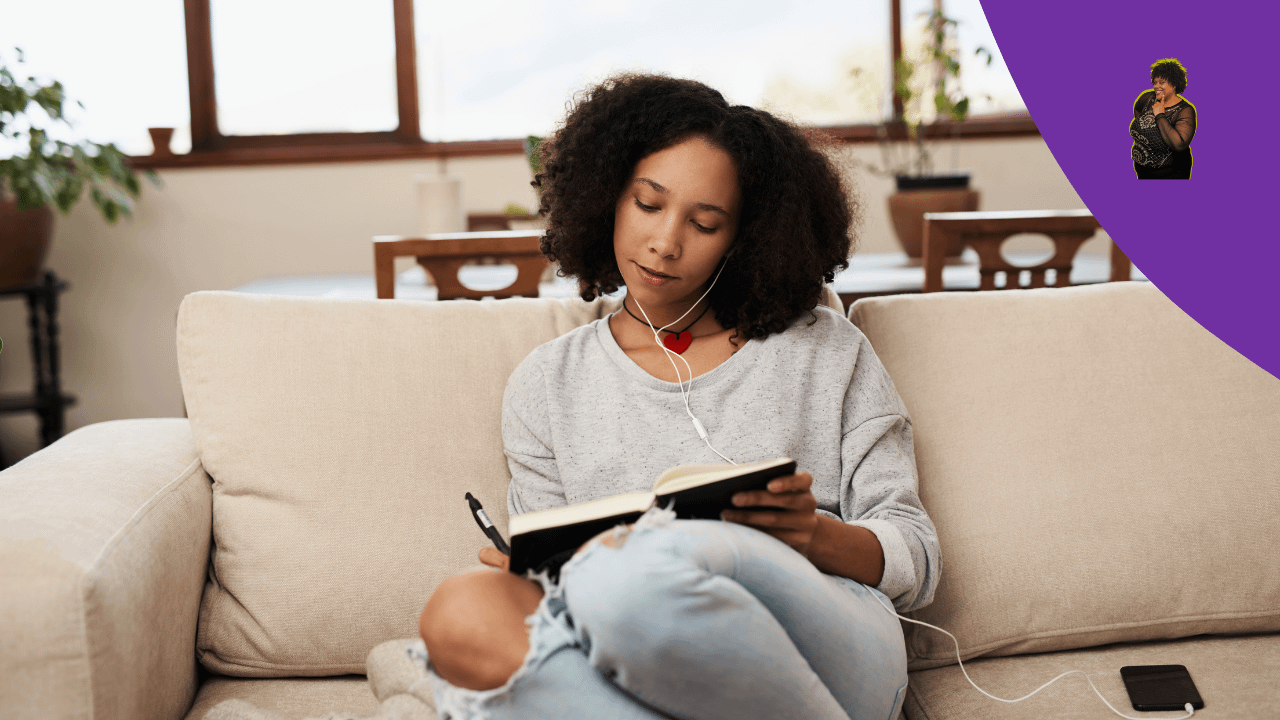 Girl sitting on couch journaling 