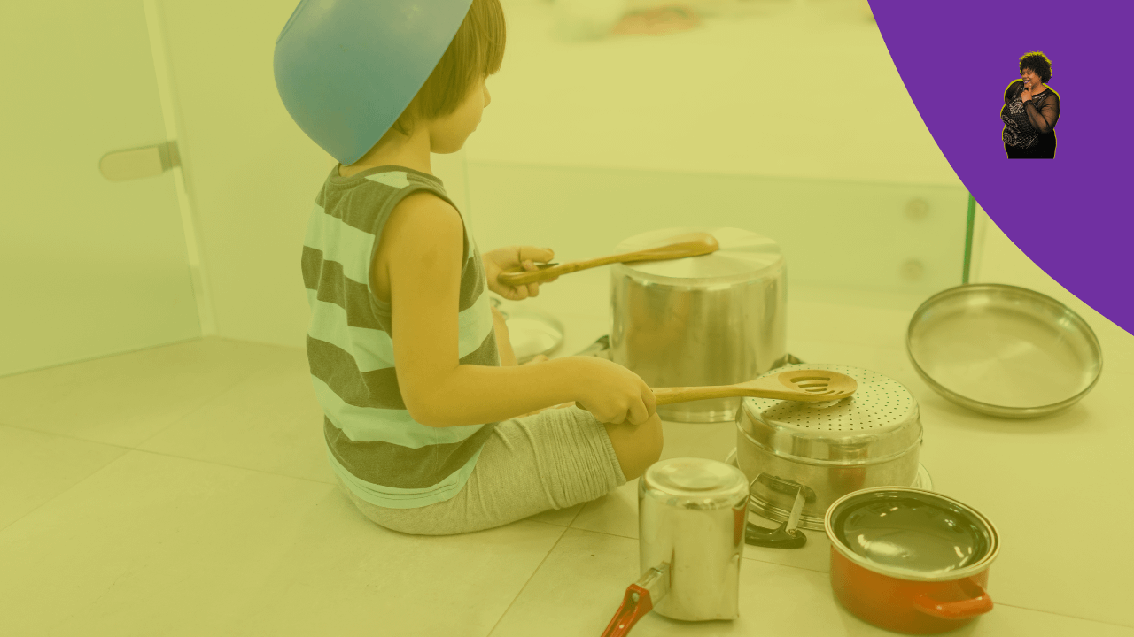 Child being themselves playing drums on pot 