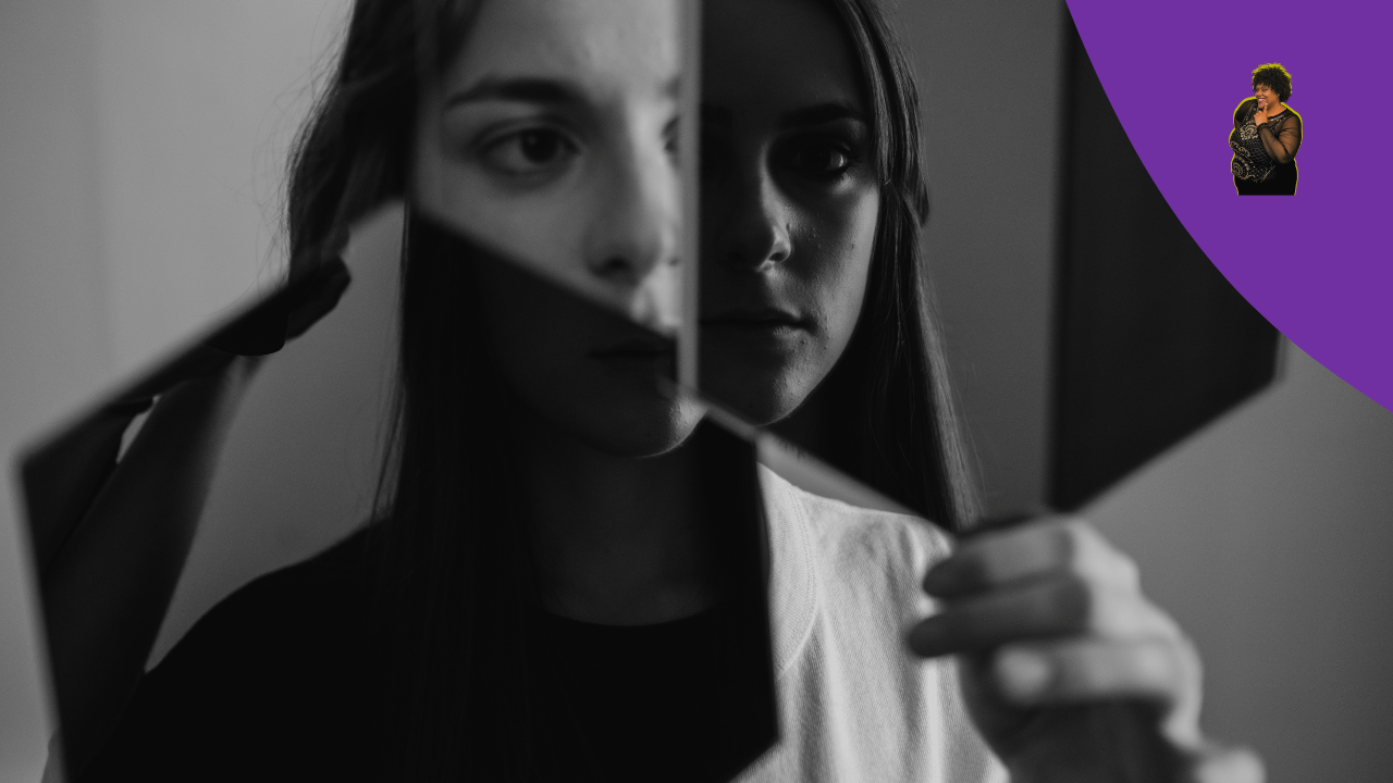 Women looking in the mirror at her reflection 